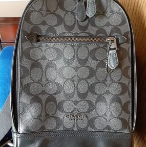 Prestine Coach signature crossbody back pack.